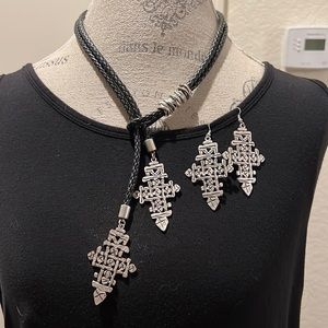 Silver tone and black leather cross choker and earrings